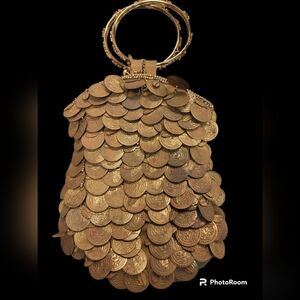 Bougainvillea Bracelet Handle purse covered in gold coins.
